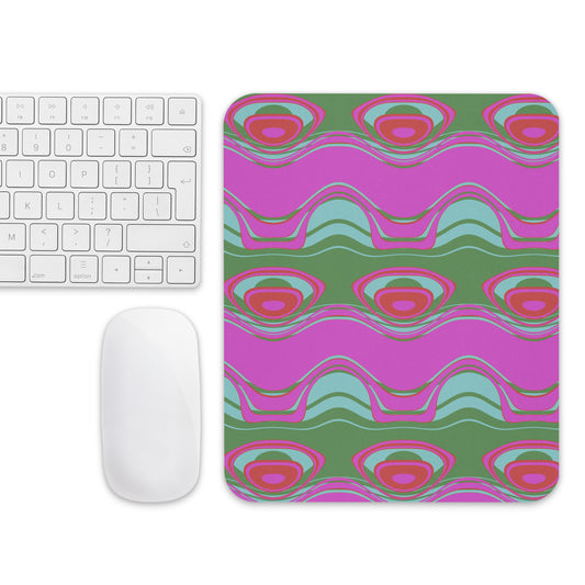 Every mouse needs a good mouse pad! "The Far Out Wave" mouse pad offers supreme grip and effortless mouse movement, and it does so with style. Pattern on pad: The Far Out Wave: "The Far Out Wave" is a retro inspired pattern. Reminiscent of a lava lamp with its floating globules. This is a pattern someone could stare into for ever and never lose interest.