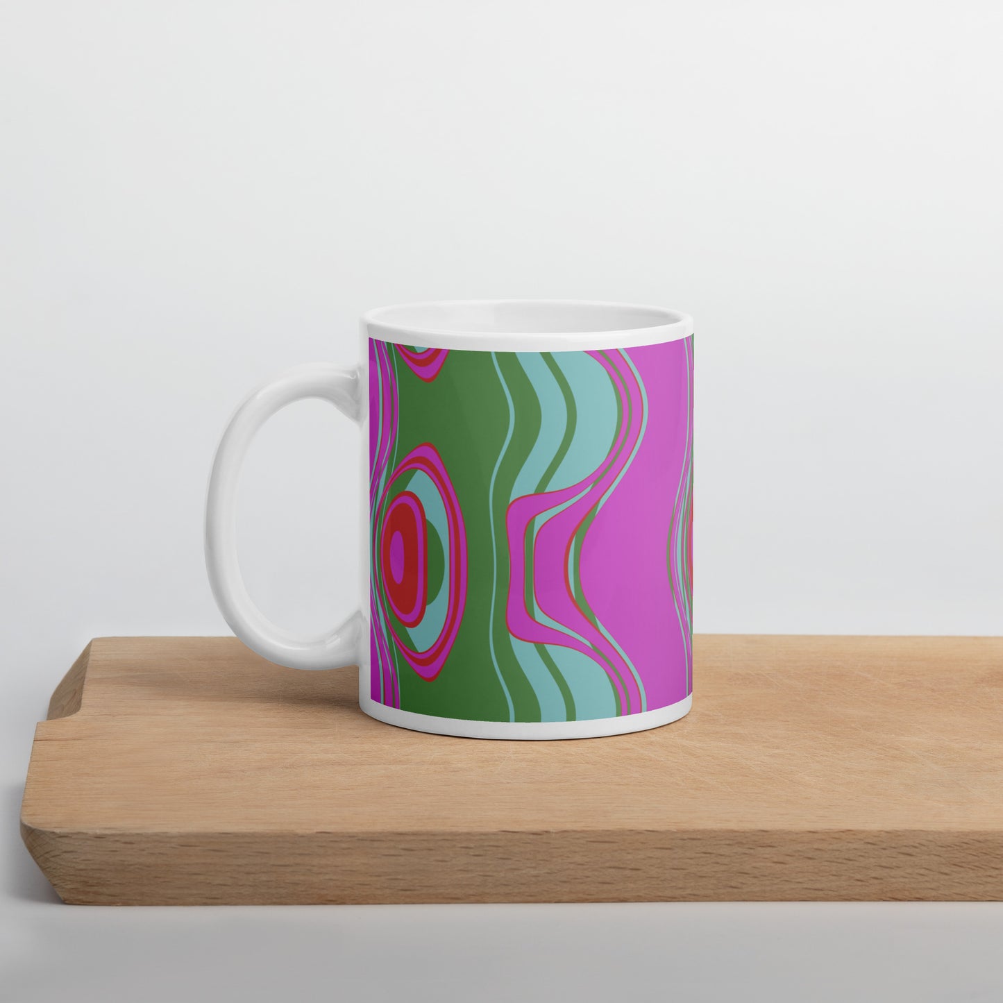 ﻿Far out man!  Whether you're drinking your morning coffee, evening tea, or something in between—this retro inspired mug's for you! It's sturdy and glossy with a vivid print that'll withstand the microwave and dishwasher.  Pattern on mug: The Far Out Wave  "The Far Out Wave" is a retro inspired pattern. Reminiscent of a lava lamp with its floating globules. This is a pattern someone could stare into for ever and never lose interest.