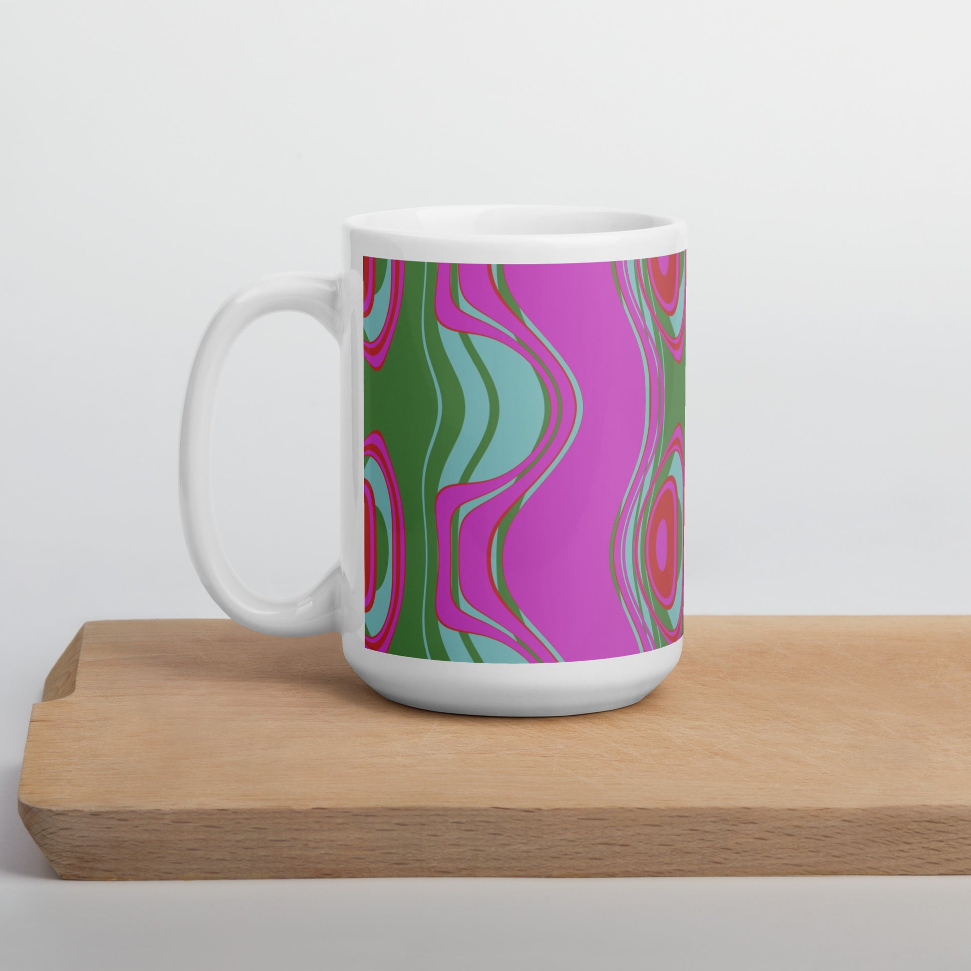 ﻿Far out man!  Whether you're drinking your morning coffee, evening tea, or something in between—this retro inspired mug's for you! It's sturdy and glossy with a vivid print that'll withstand the microwave and dishwasher.  Pattern on mug: The Far Out Wave  "The Far Out Wave" is a retro inspired pattern. Reminiscent of a lava lamp with its floating globules. This is a pattern someone could stare into for ever and never lose interest.